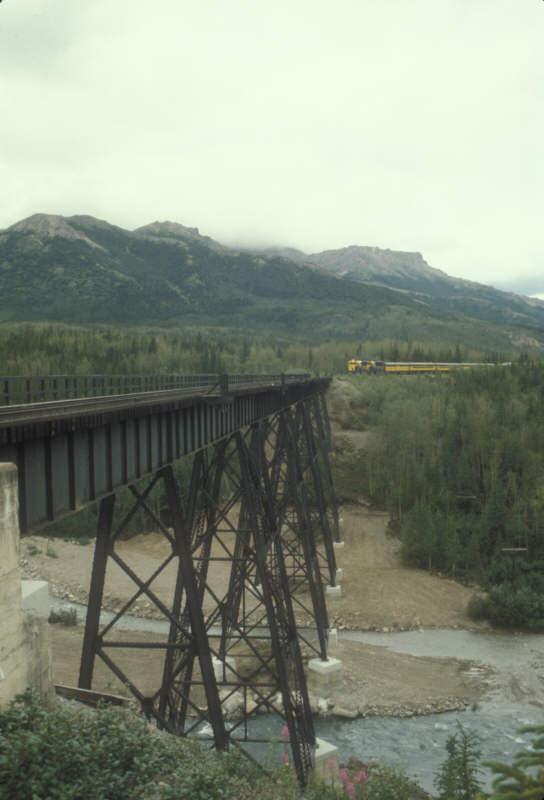 ak-13-21 Denali National Park train approaches bridge